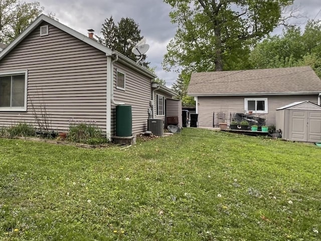 2912 Magellan Dr, Mchenry, IL 60051 - back of house featuring a shed, an outbuilding, a yard, and cooling unit