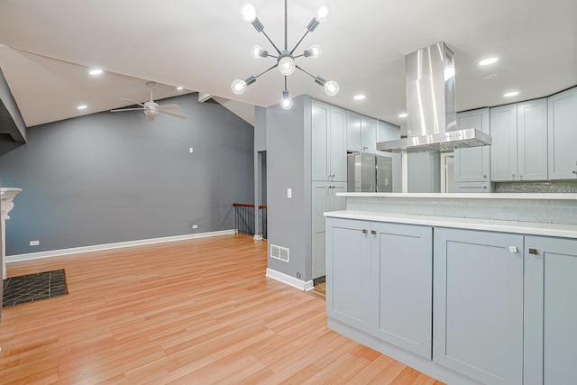 359 Juniper Tree Ct, Hoffman Estates, IL 60169 - kitchen with a ceiling fan, baseboards, island exhaust hood, light wood-style floors, and light countertops