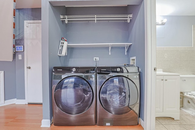359 Juniper Tree Ct, Hoffman Estates, IL 60169 - laundry room with laundry area, washer and dryer, and wood finished floors