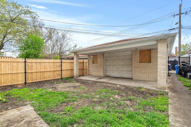 8943 S Lowe Ave, Chicago, IL 60620 - exterior space featuring driveway, an outbuilding, and a fenced backyard