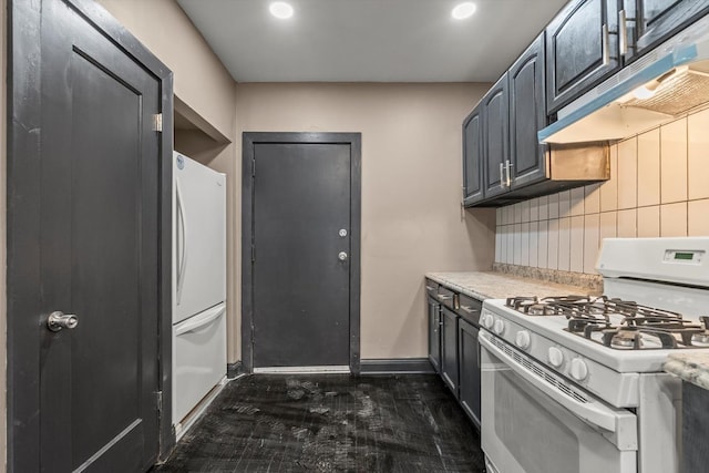 8943 S Lowe Ave, Chicago, IL 60620 - kitchen featuring extractor fan, light countertops, tasteful backsplash, and white appliances