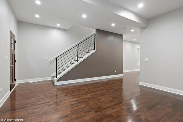4631 S Evans Ave, Chicago, IL 60653 - unfurnished living room with stairway, wood finished floors, baseboards, and recessed lighting