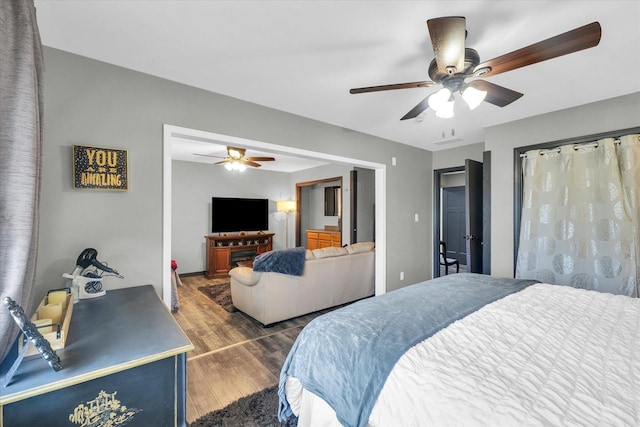 bedroom featuring wood finished floors and a ceiling fan