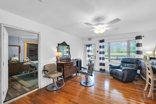 sitting room featuring ceiling fan and wood-type flooring