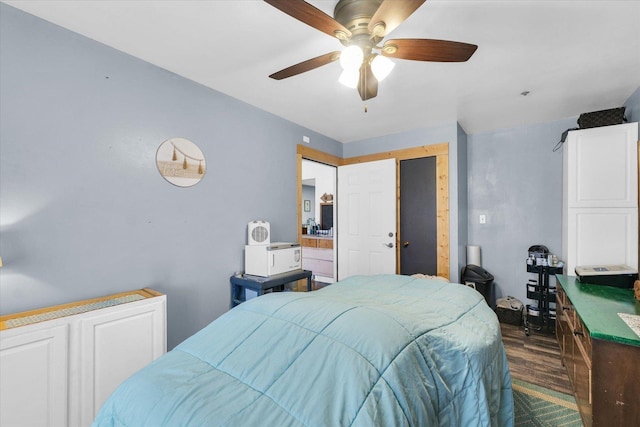 bedroom with dark wood-type flooring and a ceiling fan