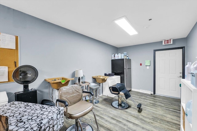 miscellaneous room with baseboards and wood finished floors