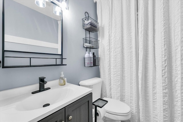 full bathroom featuring toilet and vanity