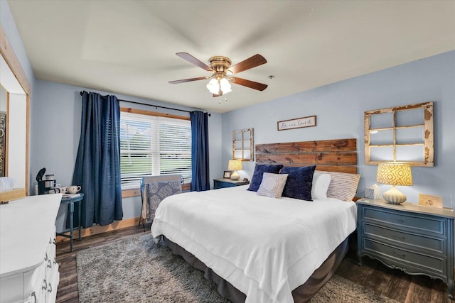 bedroom with dark wood-style floors and a ceiling fan
