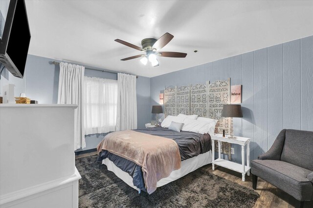 bedroom with ceiling fan and wood finished floors