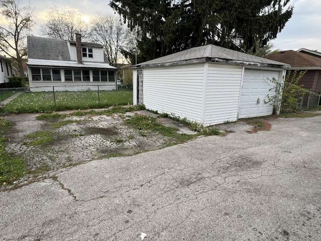 detached garage with fence
