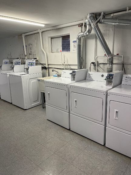 725 Grove Dr Unit 209, Buffalo Grove, IL 60089 - community laundry room featuring separate washer and dryer