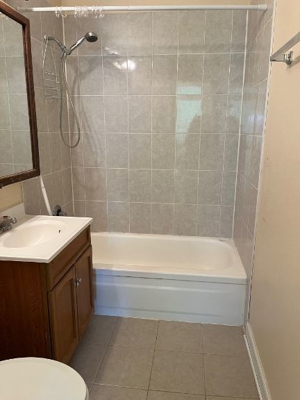725 Grove Dr Unit 209, Buffalo Grove, IL 60089 - full bath featuring tile patterned floors, vanity, toilet, and shower / tub combination
