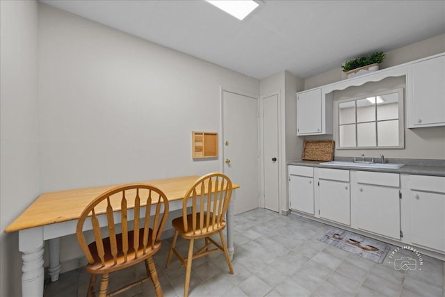 1313A S Rebecca Rd Unit 202, Lombard, IL 60148 - kitchen with a sink, white cabinetry, and light flooring