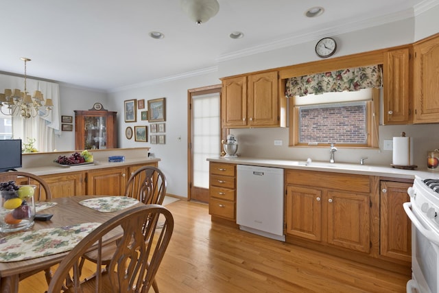 437 Wingate Dr, Schaumburg, IL 60193 - kitchen featuring white appliances, a sink, light countertops, a chandelier, and light wood-style flooring