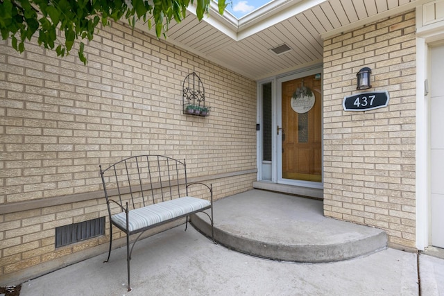 437 Wingate Dr, Schaumburg, IL 60193 - doorway to property featuring covered porch and brick siding