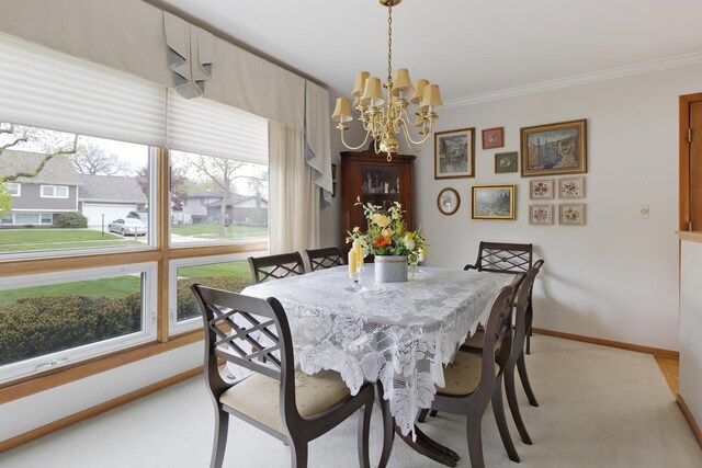 437 Wingate Dr, Schaumburg, IL 60193 - dining room with a chandelier, light colored carpet, ornamental molding, plenty of natural light, and baseboards