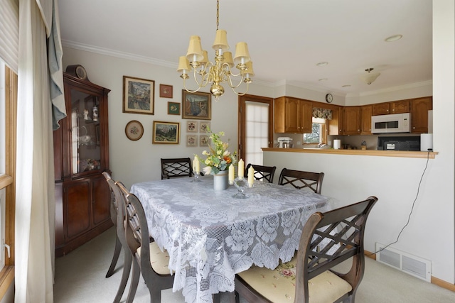 437 Wingate Dr, Schaumburg, IL 60193 - dining space with a chandelier, ornamental molding, and light colored carpet