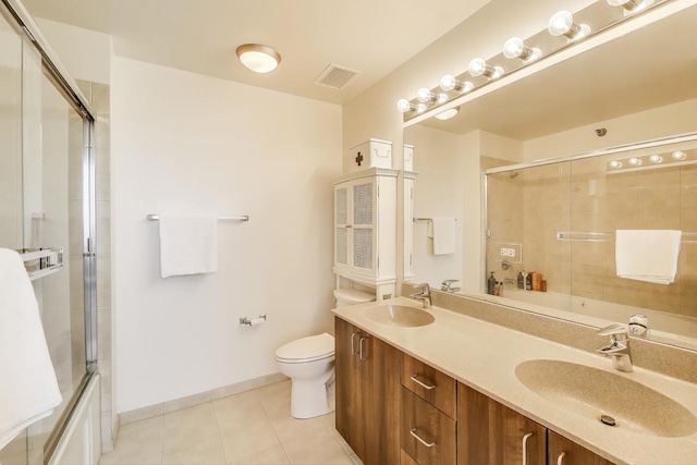 235 W Van Buren St Unit 3414, Chicago, IL 60607 - full bath featuring toilet, tile patterned floors, double vanity, baseboards, and enclosed tub / shower combo