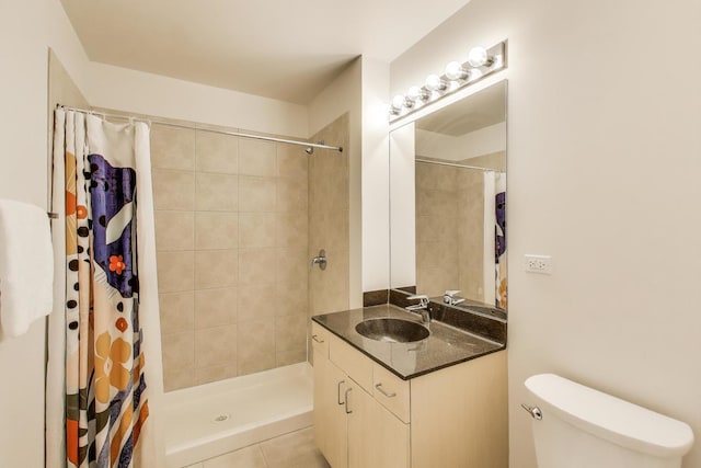 235 W Van Buren St Unit 3414, Chicago, IL 60607 - bathroom featuring a tile shower, vanity, toilet, and tile patterned flooring