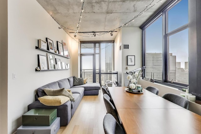 235 W Van Buren St Unit 3414, Chicago, IL 60607 - dining area with wood finished floors, rail lighting, and a city view