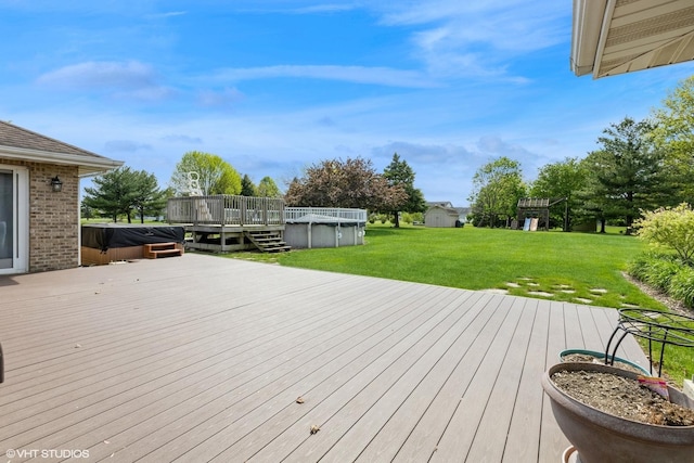 wooden terrace with a covered hot tub, a covered pool, and a lawn