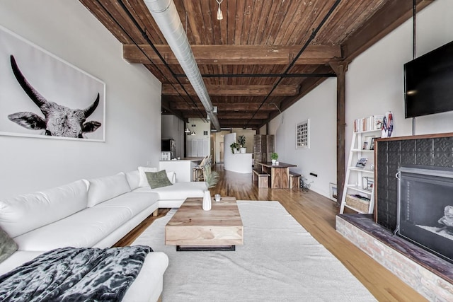 1000 W Washington Blvd Unit 342, Chicago, IL 60607 - living area featuring a tile fireplace, wooden ceiling, and wood finished floors