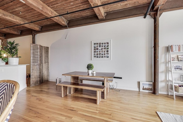 1000 W Washington Blvd Unit 342, Chicago, IL 60607 - dining area with baseboards, beamed ceiling, light wood-type flooring, and wood ceiling
