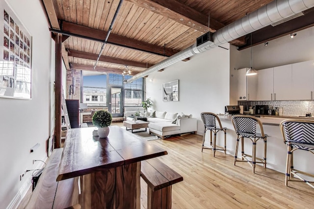 1000 W Washington Blvd Unit 342, Chicago, IL 60607 - dining room with light wood-style flooring, wood ceiling, beamed ceiling, and baseboards