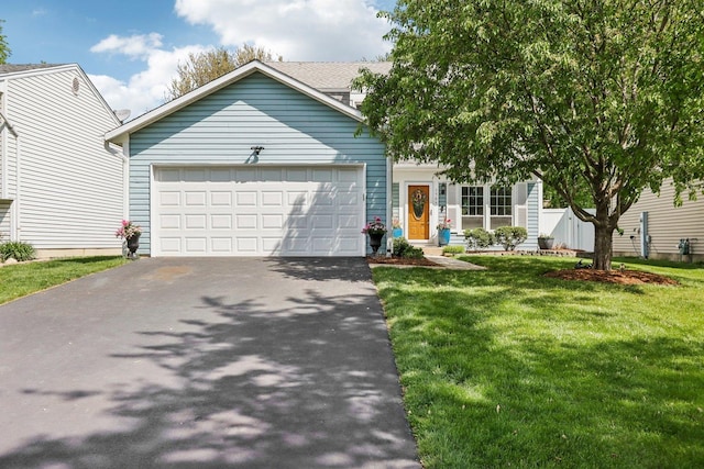 1509 Wilson Ave, Wheaton, IL 60189 - view of front facade with asphalt driveway, a garage, and a front yard