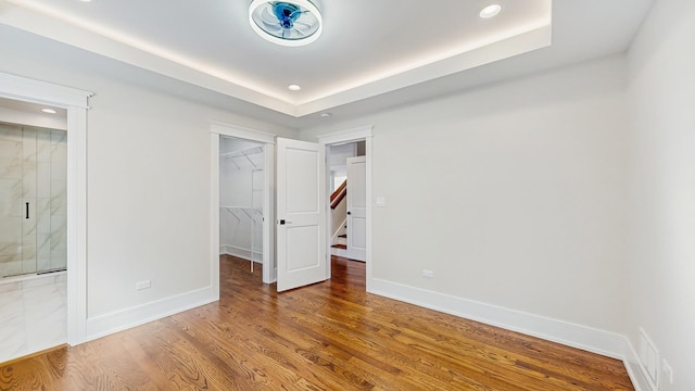 unfurnished bedroom featuring visible vents, a spacious closet, and recessed lighting