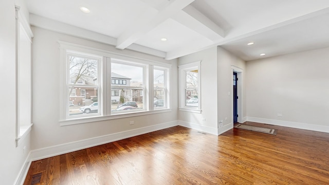 unfurnished room with light wood finished floors, beam ceiling, visible vents, baseboards, and recessed lighting