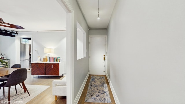 hallway with light wood-style flooring