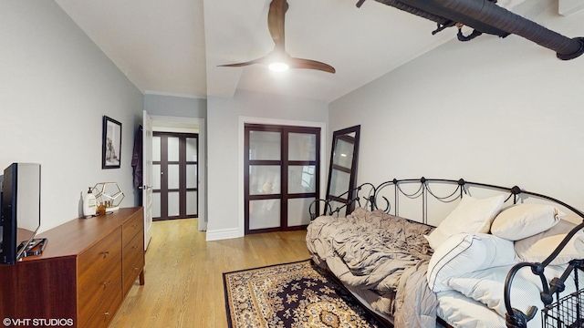 bedroom featuring light wood-type flooring, french doors, and baseboards