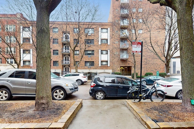 view of property featuring uncovered parking