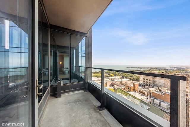 balcony featuring a water view