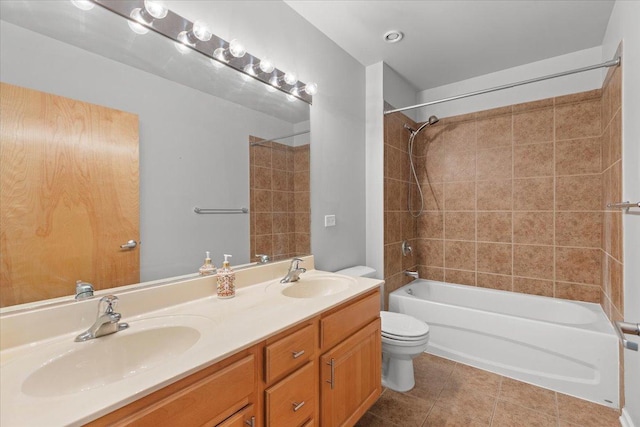 bathroom with toilet, double vanity, bathtub / shower combination, and tile patterned flooring