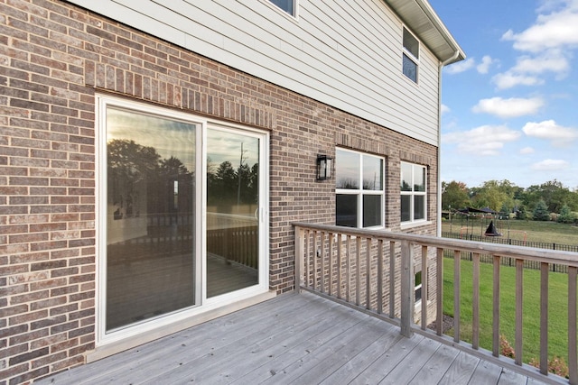 wooden terrace with a yard