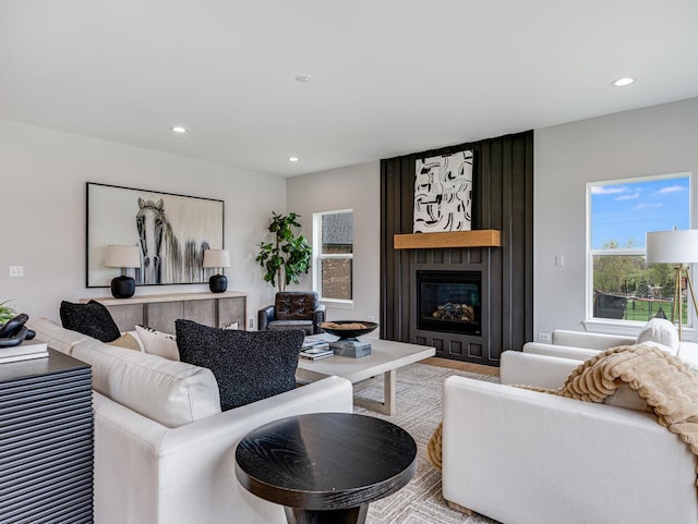 living room featuring recessed lighting and a fireplace