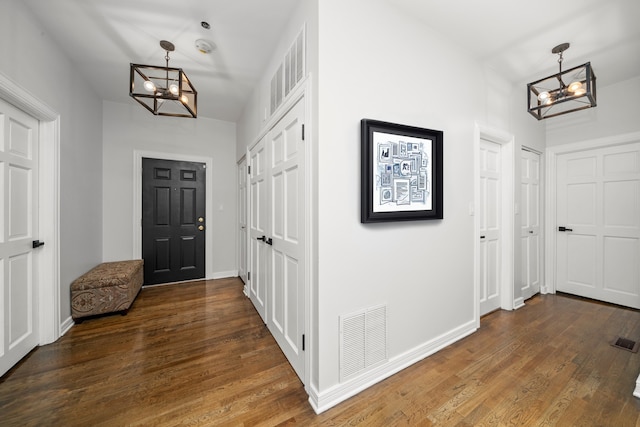 4353 S Indiana Ave Unit 3, Chicago, IL 60653 - foyer with a chandelier, wood finished floors, and baseboards