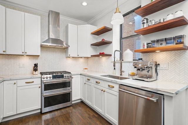 4353 S Indiana Ave Unit 3, Chicago, IL 60653 - kitchen with appliances with stainless steel finishes, wall chimney range hood, open shelves, a sink, and crown molding