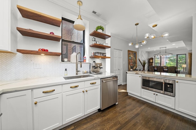 4353 S Indiana Ave Unit 3, Chicago, IL 60653 - kitchen featuring stainless steel appliances, a sink, open shelves, crown molding, and dark wood-type flooring