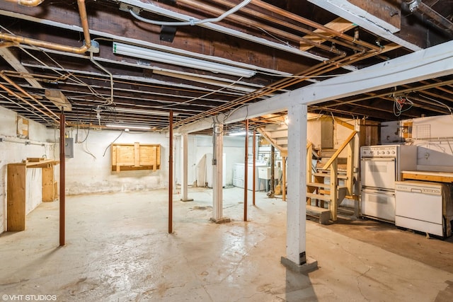 unfinished basement with independent washer and dryer and electric panel