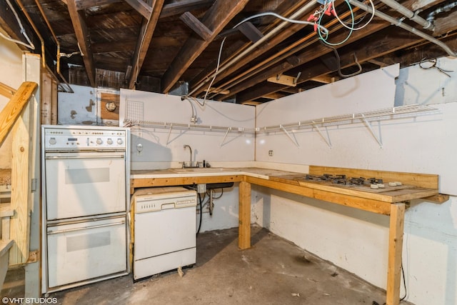 unfinished basement with a sink and a workshop area