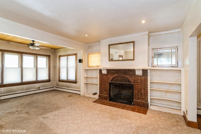 unfurnished living room with carpet, a ceiling fan, healthy amount of natural light, ornamental molding, and recessed lighting