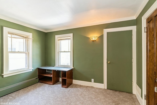 unfurnished office featuring ornamental molding, carpet flooring, and a baseboard radiator