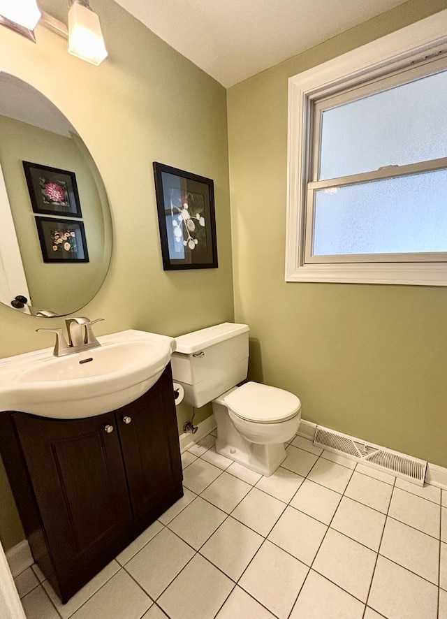 9 Aberdeen Rd, Hawthorn Woods, IL 60047 - half bath featuring toilet, vanity, visible vents, tile patterned flooring, and baseboards