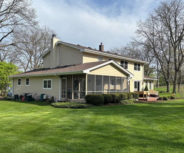 9 Aberdeen Rd, Hawthorn Woods, IL 60047 - back of house with a sunroom, outdoor lounge area, a chimney, and a lawn