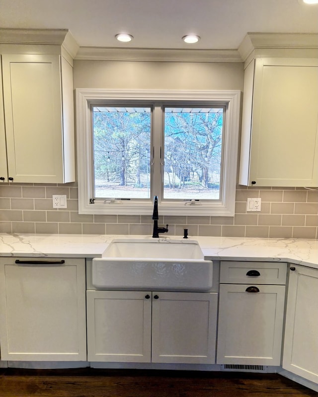 9 Aberdeen Rd, Hawthorn Woods, IL 60047 - kitchen with a sink, ornamental molding, decorative backsplash, and light stone counters