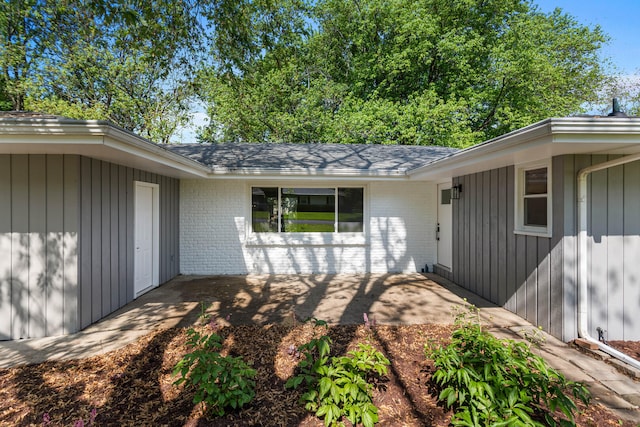 2705 Arlene Dr, Urbana, IL 61802 - doorway to property featuring brick siding and a patio area