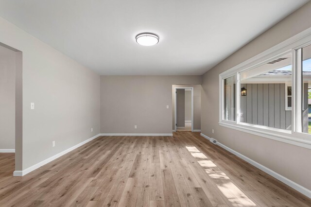 2705 Arlene Dr, Urbana, IL 61802 - spare room with light wood-style flooring, healthy amount of natural light, and baseboards